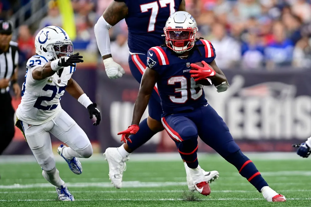 August 19, 2022; Foxborough, MA, USA; New England Patriots running back  J.J. Taylor (42) avoids a tackle during the NFL pre-season game between  Carolina Panthers and New England Patriots at Gillette Stadium.