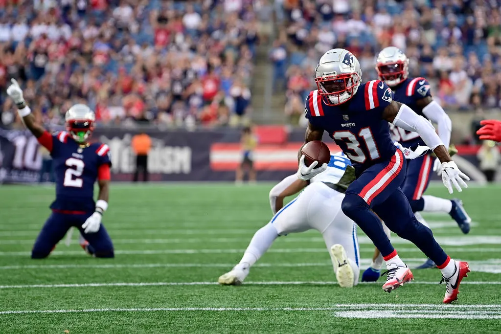 FOXBOROUGH, MASSACHUSETTS - NOVEMBER 06: Jonathan Jones #31 of the New England Patriots runs with the ball during the second half of a game against the Indianapolis Colts at Gillette Stadium on November 06, 2022 in Foxborough, Massachusetts. (Photo by Billie Weiss/Getty Images)