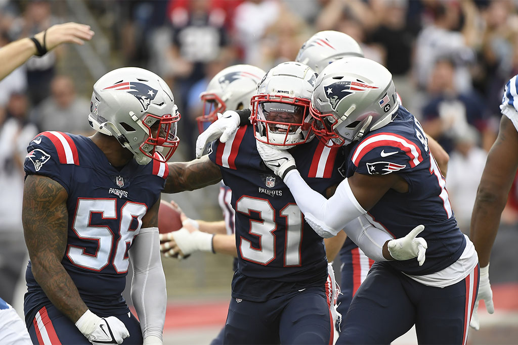Nov 6, 2022; Foxborough, Massachusetts, USA; New England Patriots cornerback Jonathan Jones (31) is congratulated by wide receiver Matthew Slater (18) and linebacker Anfernee Jennings (58) after blocking a punt during the first half against the Indianapolis Colts at Gillette Stadium. Mandatory Credit: Bob DeChiara-USA TODAY Sports