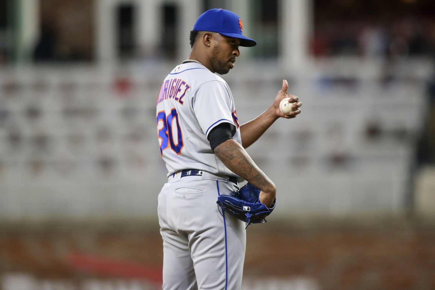 Sep 30, 2022; Atlanta, Georgia, USA; New York Mets relief pitcher Joely Rodriguez (30) reacts after rolling his sleeves up against the Atlanta Braves in the eighth inning at Truist Park. Mandatory Credit: Brett Davis/USA TODAY Sports