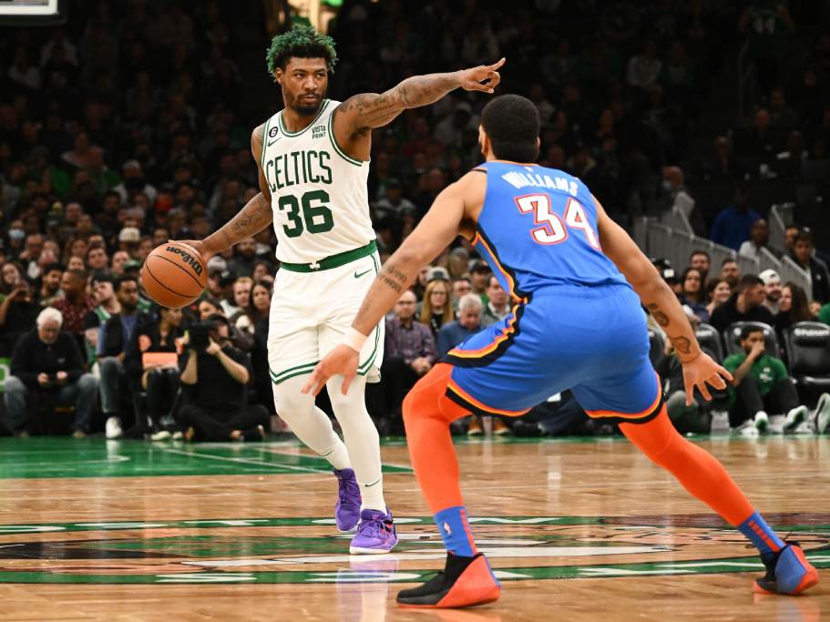 Nov 14, 2022; Boston, Massachusetts, USA; Boston Celtics guard Marcus Smart (36) signals a play in front of Oklahoma City Thunder forward Kenrich Williams (34) during the first half at the TD Garden. Credit: Brian Fluharty-USA TODAY Sports