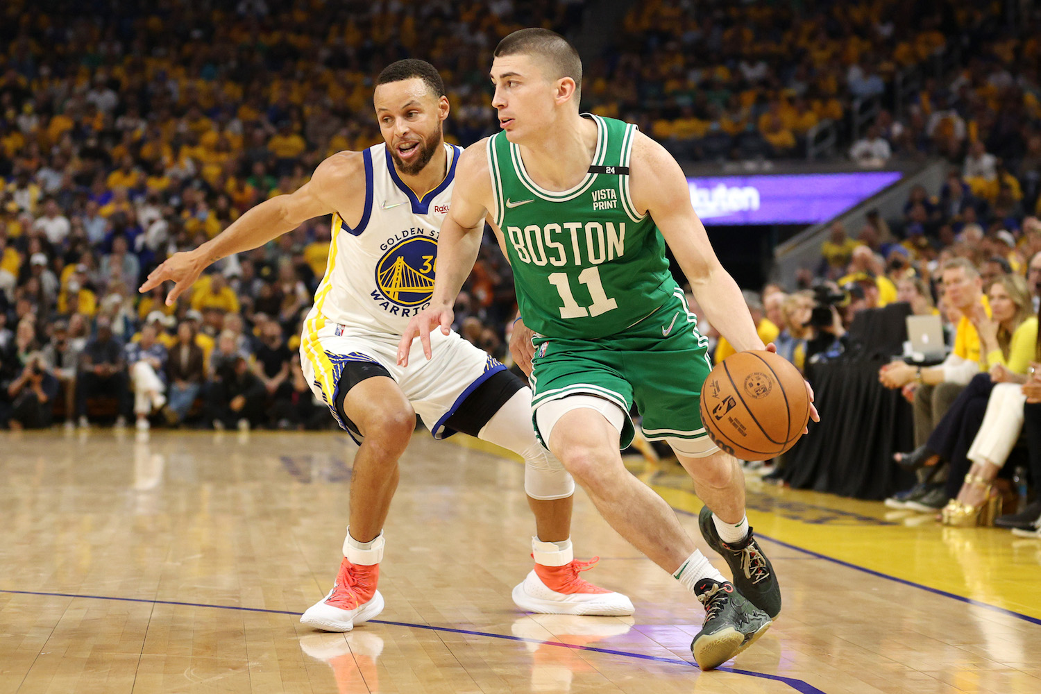 SAN FRANCISCO, CALIFORNIA - JUNE 05: Payton Pritchard #11 of the Boston Celtics drives past Stephen Curry #30 of the Golden State Warriors during the first quarter in Game Two of the 2022 NBA Finals at Chase Center on June 05, 2022 in San Francisco, California. NOTE TO USER: User expressly acknowledges and agrees that, by downloading and/or using this photograph, User is consenting to the terms and conditions of the Getty Images License Agreement. (Photo by Ezra Shaw/Getty Images)