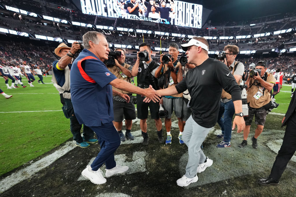LAS VEGAS, NEVADA - AUGUST 26:  (L-R) ead coach Bill Belichick of the New England Patriots and head coach Josh McDaniels of the Las Vegas Raiders shake hands after their preseason game at Allegiant Stadium on August 26, 2022 in Las Vegas, Nevada. (Photo by Chris Unger/Getty Images)