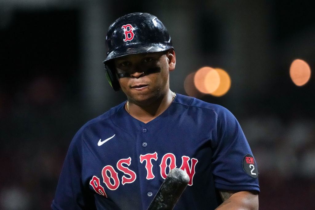 CINCINNATI, OHIO - SEPTEMBER 21: Rafael Devers #11 of the Boston Red Sox walks back to the dugout after striking out in the sixth inning against the Cincinnati Reds at Great American Ball Park on September 21, 2022 in Cincinnati, Ohio. (Photo by Dylan Buell/Getty Images)