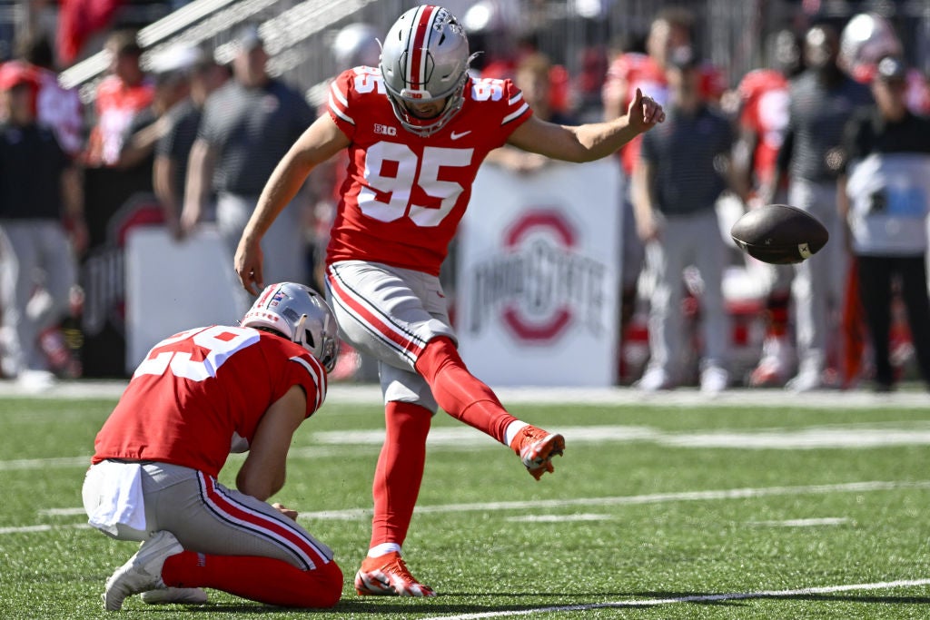 COLUMBUS, OHIO - OCTOBER 22: Kicker Noah Ruggles #95 of the Ohio State Buckeyes kicks a field goal in the second quarter against the Iowa Hawkeyes at Ohio Stadium on October 22, 2022 in Columbus, Ohio. (Photo by Gaelen Morse/Getty Images)