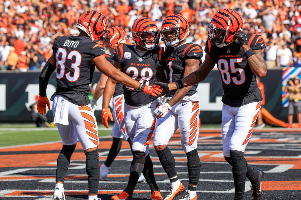CINCINNATI, OHIO - OCTOBER 23: Tyler Boyd #83 and Tee Higgins #85 of the Cincinnati Bengals celebrate after Ja'Marr Chase #1 made a catch for a touchdown against the Atlanta Falcons during the first half at Paycor Stadium on October 23, 2022 in Cincinnati, Ohio. (Photo by Justin Casterline/Getty Images)