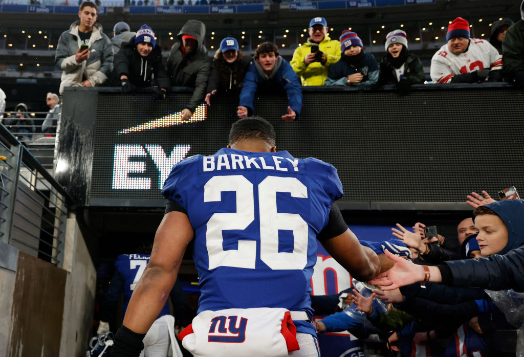 EAST RUTHERFORD, NEW JERSEY - DECEMBER 11: Saquon Barkley #26 of the New York Giants walks off the field after being defeated by the Philadelphia Eagles 48-22 at MetLife Stadium on December 11, 2022 in East Rutherford, New Jersey. (Photo by Al Bello/Getty Images)