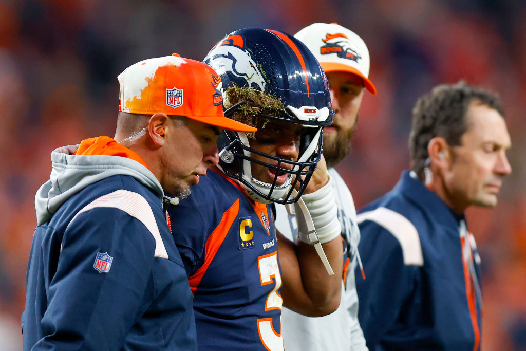 DENVER, COLORADO - DECEMBER 11: Russell Wilson #3 of the Denver Broncos walks off the field after sustaining a concussion in the fourth quarter of a game against the Kansas City Chiefs at Empower Field At Mile High on December 11, 2022 in Denver, Colorado. (Photo by Justin Edmonds/Getty Images)