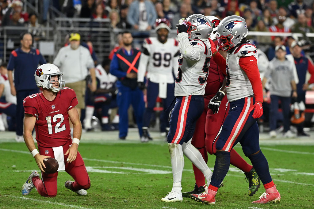 GLENDALE, ARIZONA - DECEMBER 12: Josh Uche #55 of the New England Patriots celebrates after sacking Colt McCoy #12 of the Arizona Cardinals during the fourth quarter of the game at State Farm Stadium on December 12, 2022 in Glendale, Arizona. (Photo by Norm Hall/Getty Images)