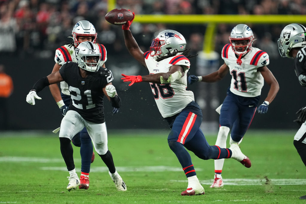 LAS VEGAS, NEVADA - DECEMBER 18: Rhamondre Stevenson #38 of the New England Patriots laterals the ball during the fourth quarter against the Las Vegas Raiders at Allegiant Stadium on December 18, 2022 in Las Vegas, Nevada. (Photo by Chris Unger/Getty Images)