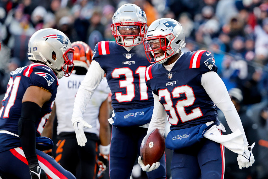 FOXBOROUGH, MASSACHUSETTS - DECEMBER 24: Devin McCourty #32 of the New England Patriots celebrates after his interception during the second quarter against the Cincinnati Bengals at Gillette Stadium on December 24, 2022 in Foxborough, Massachusetts. (Photo by Winslow Townson/Getty Images)