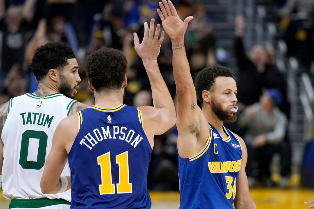 SAN FRANCISCO, CALIFORNIA - DECEMBER 10: Klay Thompson #11 and Stephen Curry #30 of the Golden State Warriors celebrates after Thompson made a three-point shot over Jayson Tatum #0 of the Boston Celtics during the third quarter of an NBA basketball game at Chase Center on December 10, 2022 in San Francisco, California. NOTE TO USER: User expressly acknowledges and agrees that, by downloading and or using this photograph, User is consenting to the terms and conditions of the Getty Images License Agreement. (Photo by Thearon W. Henderson/Getty Images)