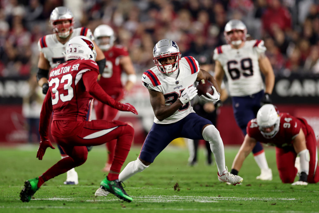 GLENDALE, ARIZONA - DECEMBER 12: Pierre Strong Jr. #35 of the New England Patriots runs the ball against Antonio Hamilton #33 of the Arizona Cardinals during the third quarter of the game at State Farm Stadium on December 12, 2022 in Glendale, Arizona. (Photo by Christian Petersen/Getty Images)