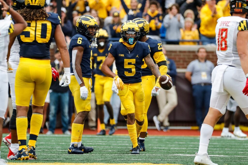 Michigan defensive back DJ Turner (5) celebrates intercepting a pass from Maryland quarterback Taulia Tagovailoa (3) during the first half at the Michigan Stadium in Ann Arbor on Saturday, Sept. 24, 2022. (Junfu Han/USA TODAY Network)