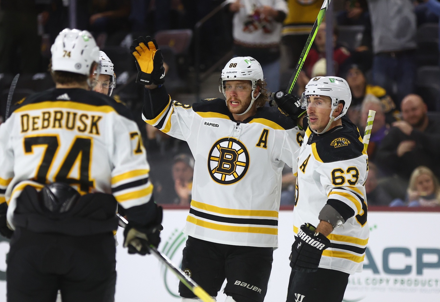 Dec 9, 2022; Tempe, Arizona, USA; Boston Bruins right wing David Pastrnak (88) celebrates a goal with left wing Brad Marchand (63) against the Arizona Coyotes in the first period at Mullett Arena. Mandatory Credit: Mark J. Rebilas/USA TODAY Sports