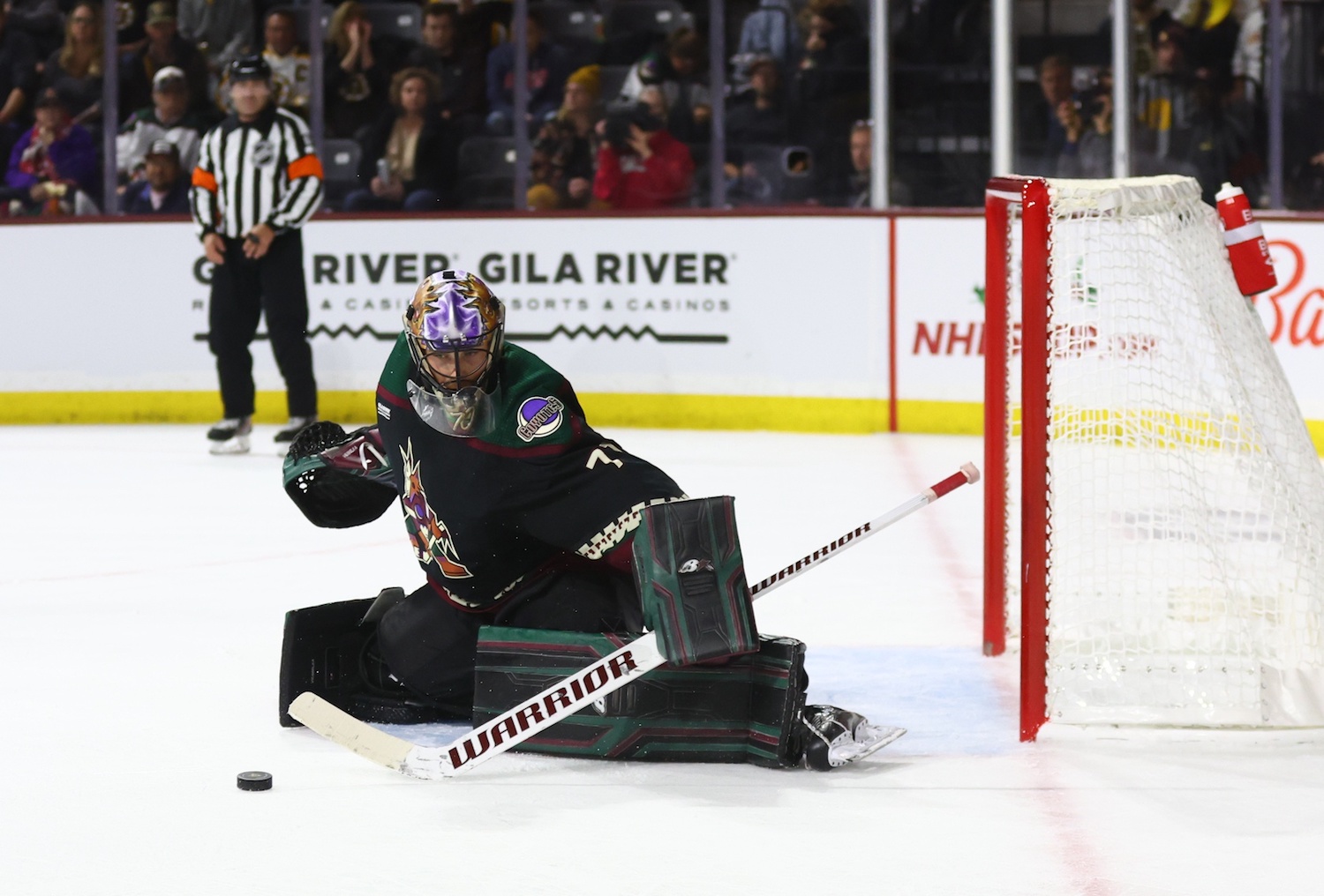 Dec 9, 2022; Tempe, Arizona, USA; Arizona Coyotes goalie Karel Vejmelka (70) stops a shot on goal by the Boston Bruins in the third period at Mullett Arena. Mandatory Credit: Mark J. Rebilas/USA TODAY Sports