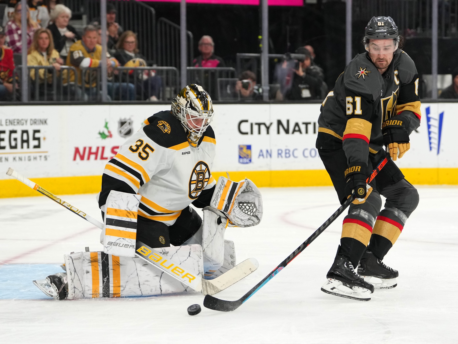 Dec 11, 2022; Las Vegas, Nevada, USA; Vegas Golden Knights right wing Mark Stone (61) deflects a pass wide of Boston Bruins goaltender Linus Ullmark (35) during the second period at T-Mobile Arena. Mandatory Credit: Stephen R. Sylvanie/USA TODAY Sports