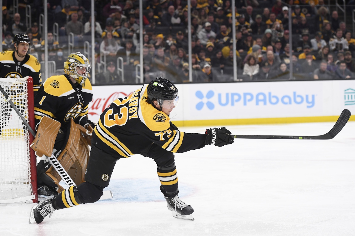 Dec 17, 2022; Boston, Massachusetts, USA;  Boston Bruins defenseman Charlie McAvoy (73) clears the puck out of the zone during the second period against the Columbus Blue Jackets at TD Garden. Mandatory Credit: Bob DeChiara/USA TODAY Sports