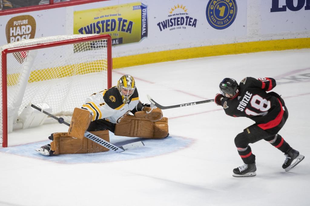 Dec 27, 2022; Ottawa, Ontario, CAN; Boston Bruins goalie Jeremy Swayman (1) makes a save on a shot from  Ottawa Senators left wing Tim Stutzle (18) in a shootout at the Canadian Tire Centre. Mandatory Credit: Marc DesRosiers/USA TODAY Sports