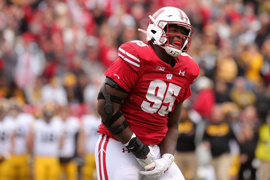 MADISON, WISCONSIN - OCTOBER 30: Keeanu Benton #95 of the Wisconsin Badgers celebrates after a fumble recovery during the first half against the Iowa Hawkeyes at Camp Randall Stadium on October 30, 2021 in Madison, Wisconsin. (Photo by Stacy Revere/Getty Images)