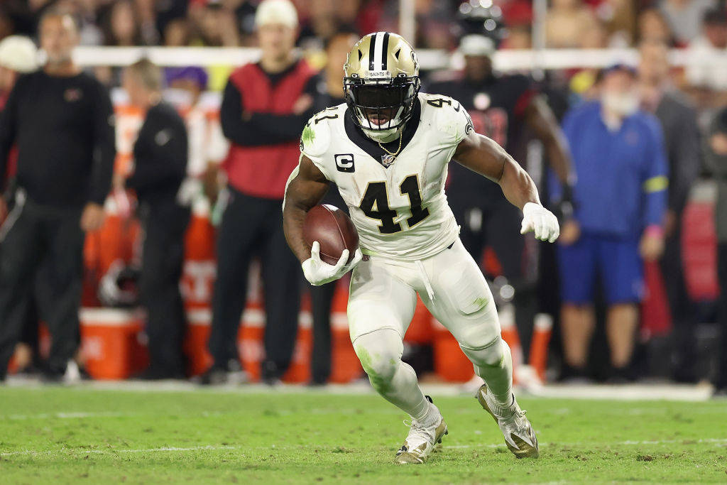 GLENDALE, ARIZONA - OCTOBER 20: Running back Alvin Kamara #41 of the New Orleans Saints rushes the football against the Arizona Cardinals during the NFL game at State Farm Stadium on October 20, 2022 in Glendale, Arizona. The Cardinals defeated the Saints 42-34. (Photo by Christian Petersen/Getty Images)