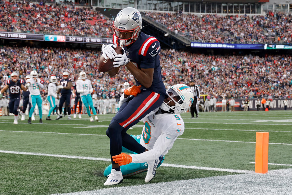 FOXBOROUGH, MASSACHUSETTS - JANUARY 01: Tyquan Thornton #11 of the New England Patriots catches a pass for a touchdown against Noah Igbinoghene #9 of the Miami Dolphins during the first quarter at Gillette Stadium on January 01, 2023 in Foxborough, Massachusetts. (Photo by Winslow Townson/Getty Images)