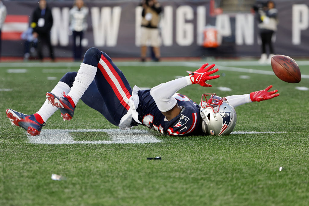 FOXBOROUGH, MASSACHUSETTS - JANUARY 01: Devin McCourty #32 of the New England Patriots misses an interception against the Miami Dolphins during the third quarter at Gillette Stadium on January 01, 2023 in Foxborough, Massachusetts. (Photo by Winslow Townson/Getty Images)