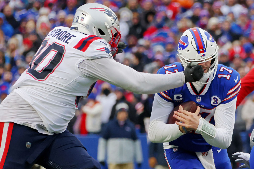 ORCHARD PARK, NEW YORK - JANUARY 08: Christian Barmore #90 of the New England Patriots tackles Josh Allen #17 of the Buffalo Bills during the second quarter at Highmark Stadium on January 08, 2023 in Orchard Park, New York. (Photo by Timothy T Ludwig/Getty Images)