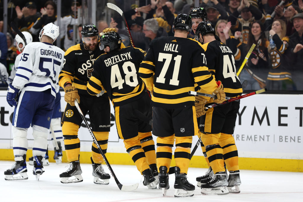 BOSTON, MASSACHUSETTS - JANUARY 14: Matt Grzelcyk #48 of the Boston Bruins celebrates with Nick Foligno #17 and Taylor Hall #71 after scoring a goal against the Toronto Maple Leafs during the third period at TD Garden on January 14, 2023 in Boston, Massachusetts. The Bruins defeat the Maple Leafs 4-3. (Photo by Maddie Meyer/Getty Images)