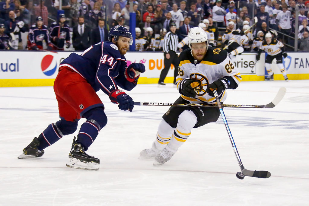 COLUMBUS, OH - MAY 6:  Vladislav Gavrikov #44 of the Columbus Blue Jackets and David Pastrnak #88 of the Boston Bruins battle for control of the puck in Game Six of the Eastern Conference Second Round during the 2019 NHL Stanley Cup Playoffs on May 6, 2019 at Nationwide Arena in Columbus, Ohio. Boston defeated Columbus 3-0 to win the series 4-2. (Photo by Kirk Irwin/Getty Images)