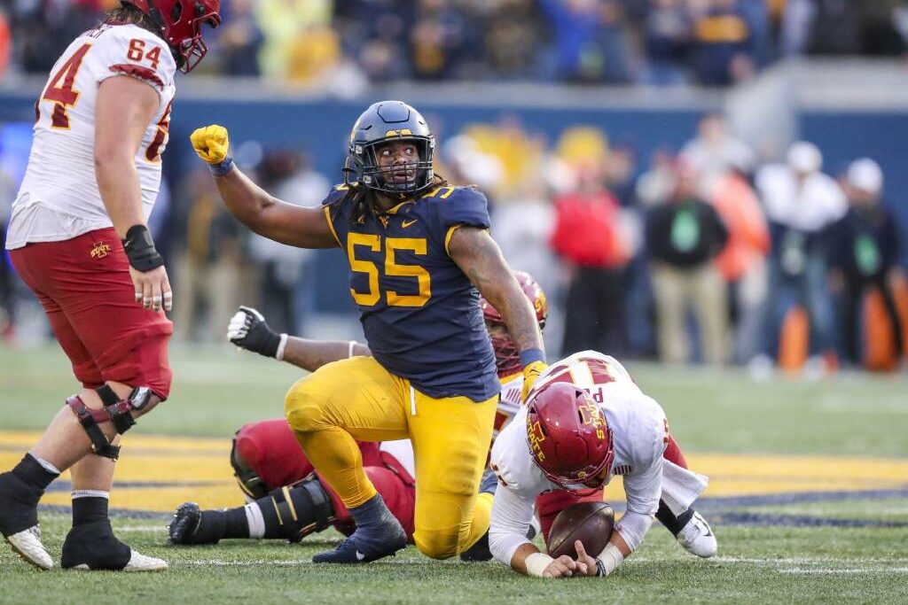 Oct 30, 2021; Morgantown, West Virginia, USA; West Virginia Mountaineers defensive lineman Dante Stills (55) celebrates after sacking Iowa State Cyclones quarterback Brock Purdy (15) during the fourth quarter at Mountaineer Field at Milan Puskar Stadium. Credit: Ben Queen-USA TODAY Sports