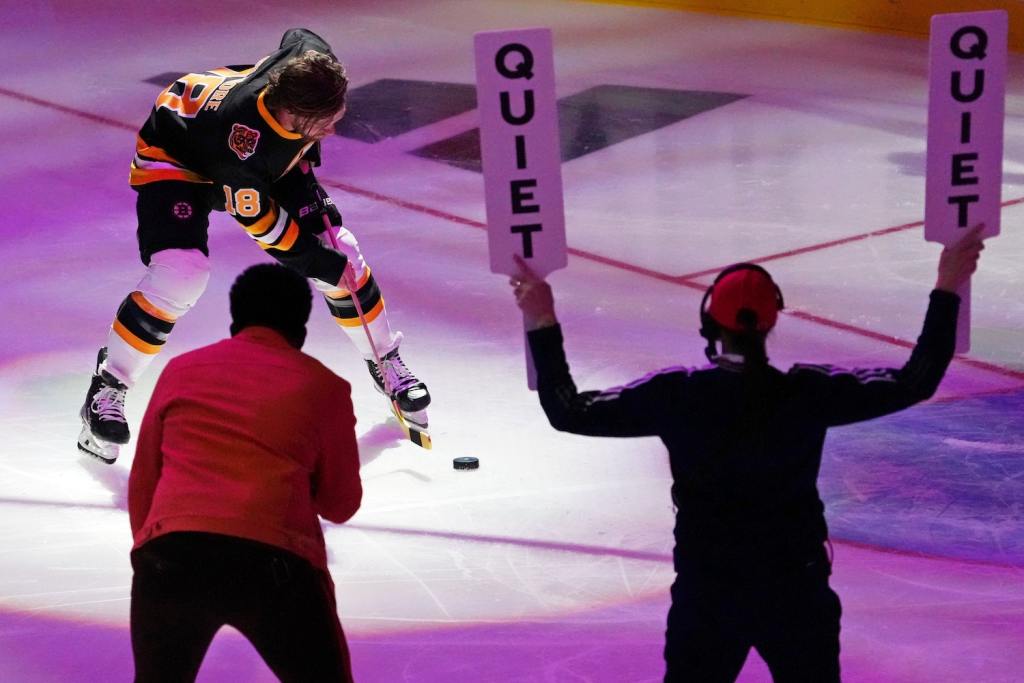 Feb 3, 2023; Sunrise, Florida, USA; Boston Bruins right wing David Pastrnak (88) shoots the puck during the 2023 NHL All-Star Skills Competition at FLA Live Arena. Mandatory Credit: Jasen Vinlove/USA TODAY Sports