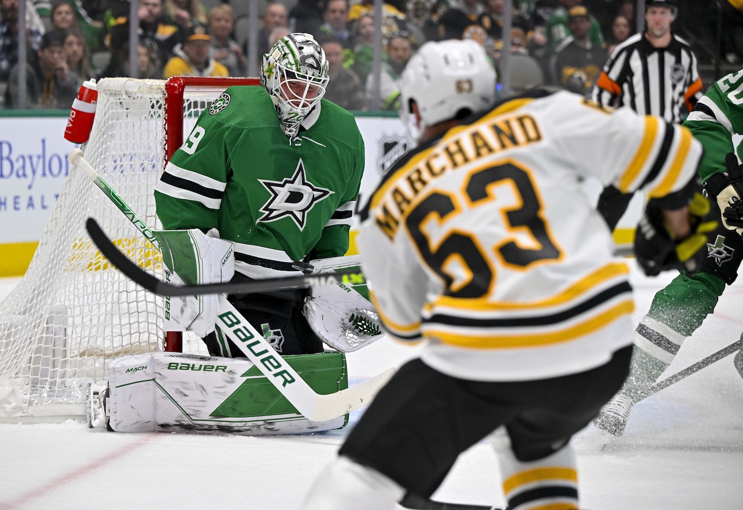 Feb 14, 2023; Dallas, Texas, USA; Dallas Stars goaltender Jake Oettinger (29) stops a shot by Boston Bruins left wing Brad Marchand (63) during the first period at the American Airlines Center. Mandatory Credit: Jerome Miron-USA TODAY Sports