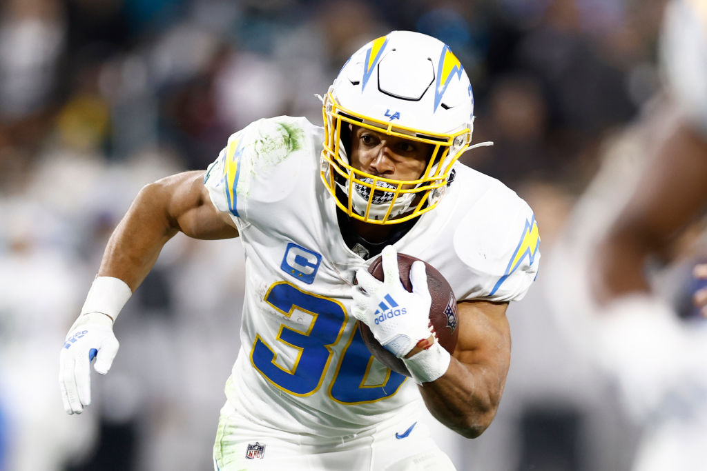 JACKSONVILLE, FLORIDA - JANUARY 14: Austin Ekeler #30 of the Los Angeles Chargers carries the ball against the Jacksonville Jaguars during the first half of the game in the AFC Wild Card playoff game at TIAA Bank Field on January 14, 2023 in Jacksonville, Florida. (Photo by Douglas P. DeFelice/Getty Images)