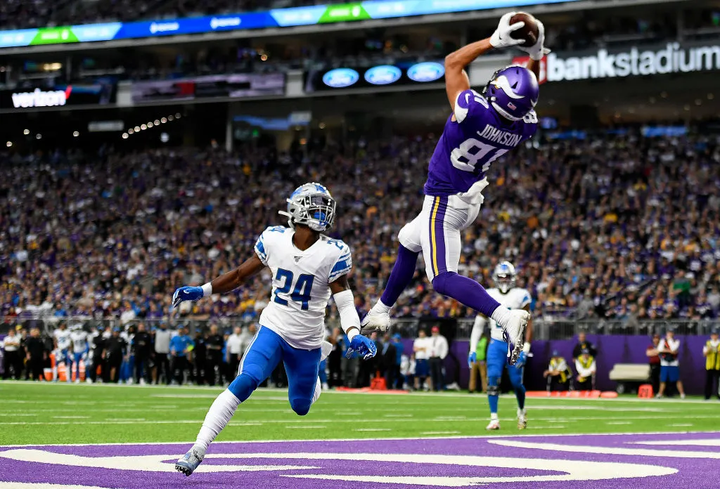 MINNEAPOLIS, MINNESOTA - DECEMBER 08: Minnesota Vikings wide receiver Bisi Johnson #81 catches a pass for a touchdown as Detroit Lions cornerback Amani Oruwariye #24 defends during the first quarter at U.S. Bank Stadium on December 08, 2019 in Minneapolis, Minnesota. (Photo by Hannah Foslien/Getty Images)