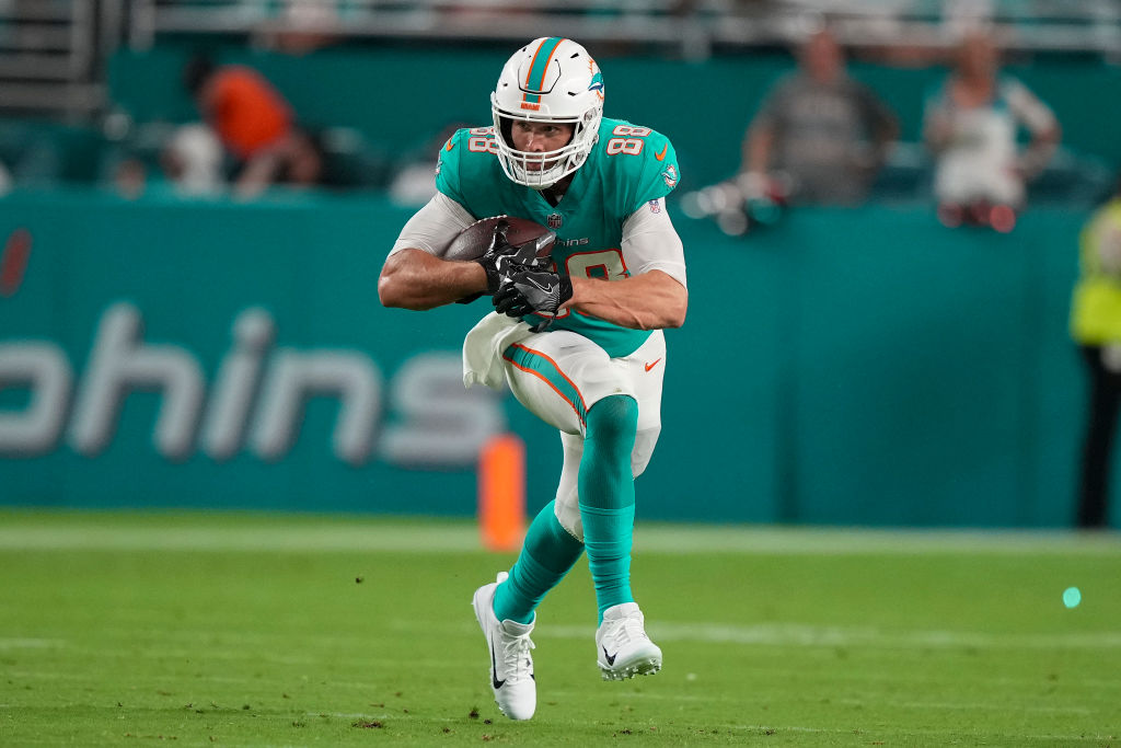 MIAMI GARDENS, FLORIDA - AUGUST 20: Mike Gesicki #88 of the Miami Dolphins heads upfield after making a catch during the second quarter of the preseason game against the Las Vegas Raiders at Hard Rock Stadium on August 20, 2022 in Miami Gardens, Florida. (Photo by Eric Espada/Getty Images)