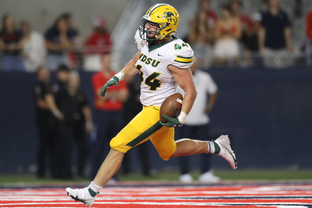 TUCSON, ARIZONA - SEPTEMBER 17: Fullback Hunter Luepke #44 of the North Dakota State Bison scores a touchdown during the second half of the NCAA football game against the Arizona Wildcats at Arizona Stadium on September 17, 2022 in Tucson, Arizona. (Photo by Rebecca Noble/Getty Images)