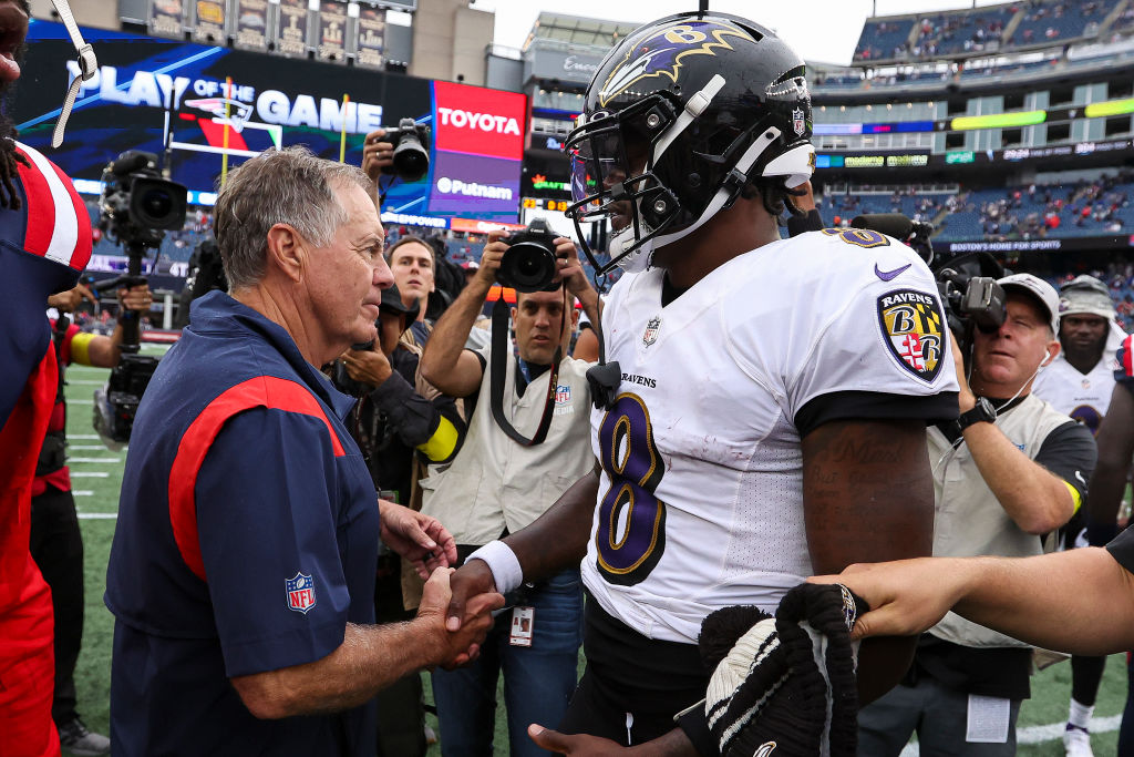 FOXBOROUGH, MASSACHUSETTS - SEPTEMBER 25: Head coach Bill Belichick of the New England Patriots shakes hands with quarterback Lamar Jackson #8 of the Baltimore Ravens after Baltimore's 37-26 win at Gillette Stadium on September 25, 2022 in Foxborough, Massachusetts. (Photo by Maddie Meyer/Getty Images)