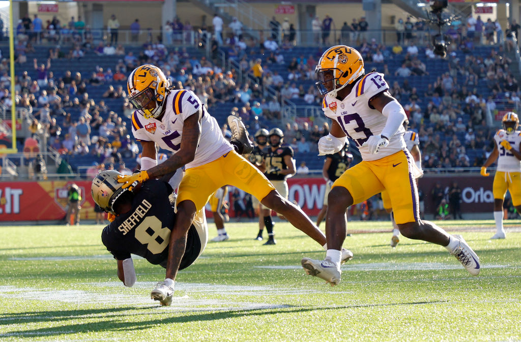 ORLANDO, FLORIDA - JANUARY 02: TJ Sheffield #8 of the Purdue Boilermakers makes a catch over Jay Ward #5 of the LSU Tigers during the Cheez-It Citrus Bowl at Camping World Stadium on January 02, 2023 in Orlando, Florida. (Photo by Mike Ehrmann/Getty Images)