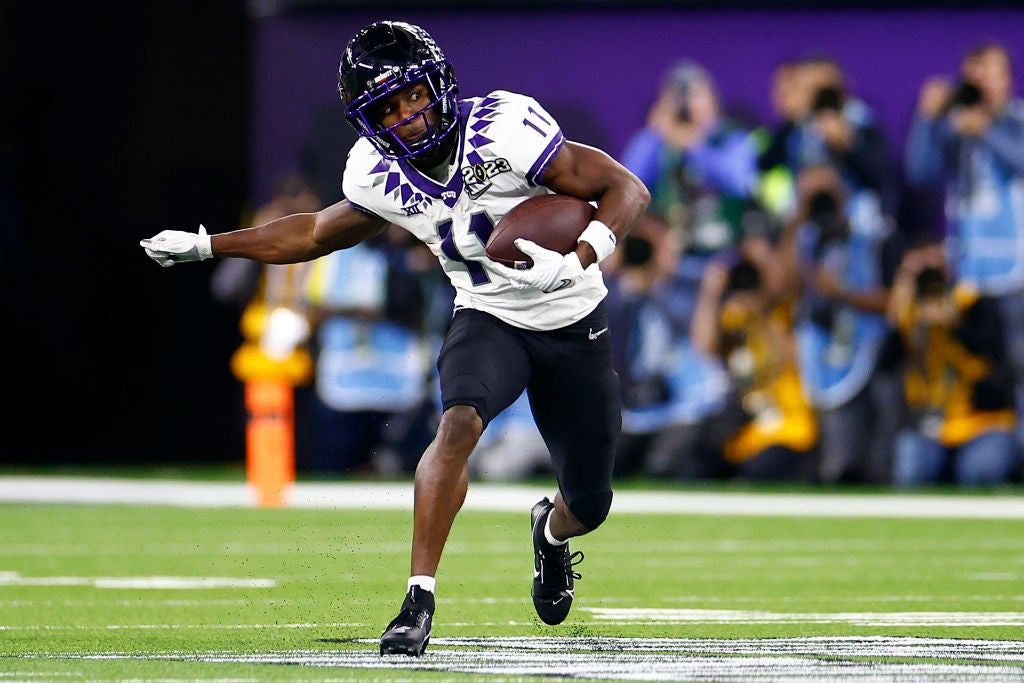 INGLEWOOD, CALIFORNIA - JANUARY 09: Derius Davis #11 of the TCU Horned Frogs runs after a catch in the third quarter against the Georgia Bulldogs in the College Football Playoff National Championship game at SoFi Stadium on January 09, 2023 in Inglewood, California. (Photo by Ronald Martinez/Getty Images)