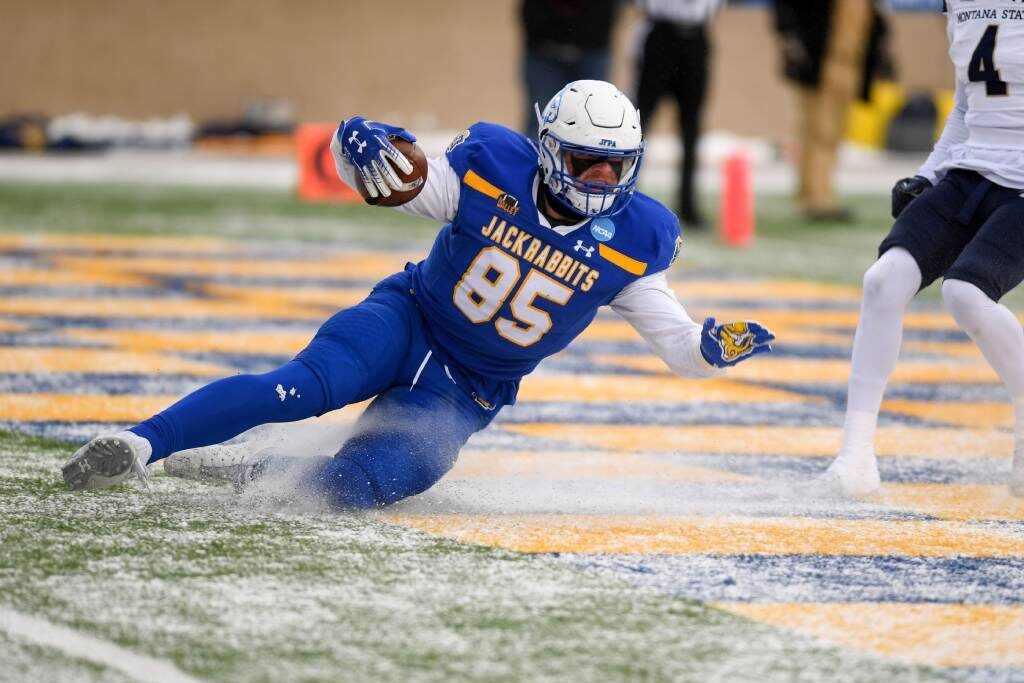 South Dakota State’s Tucker Kraft uses the existing layer of snow to slide into the end zone for the first touchdown of the FCS semifinal game against Montana State on Saturday, December 17, 2022, at Dana J. Dykhouse Stadium in Brookings, SD. (Erin Woodiel/Argus Leader/USA Today Network)