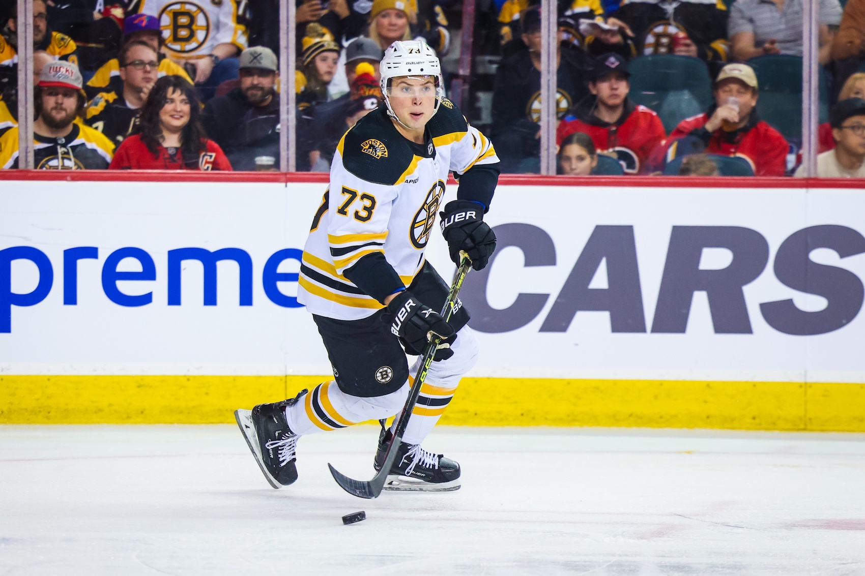 Feb 28, 2023; Calgary, Alberta, CAN; Boston Bruins defenseman Charlie McAvoy (73) skates with the puck against the Calgary Flames during the second period at Scotiabank Saddledome. Mandatory Credit: Sergei Belski-USA TODAY Sports