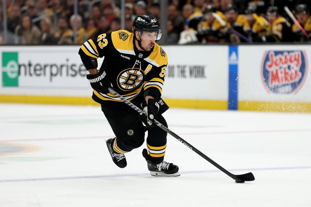 BOSTON, MASSACHUSETTS - APRIL 26: Brad Marchand #63 of the Boston Bruins skates with the puck against the Florida Panthers during the first period in Game Five of the First Round of the 2023 Stanley Cup Playoffs at TD Garden on April 26, 2023 in Boston, Massachusetts. (Photo by Maddie Meyer/Getty Images)