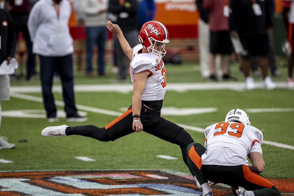 Feb 1, 2023; Mobile, AL, USA; National kicker Chad Ryland of Maryland (38) kicks with National punter Bryce Baringer of Michigan State (99) holding during the second day of Senior Bowl week at Hancock Whitney Stadium in Mobile. Mandatory Credit: Vasha Hunt-USA TODAY Sports