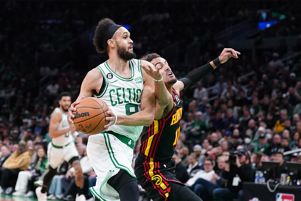 Apr 18, 2023; Boston, Massachusetts, USA; Boston Celtics guard Derrick White (9) drives the ball against Atlanta Hawks guard Trae Young (11) in the first quarter during game two of the 2023 NBA playoffs at TD Garden. Mandatory Credit: David Butler II-USA TODAY Sports