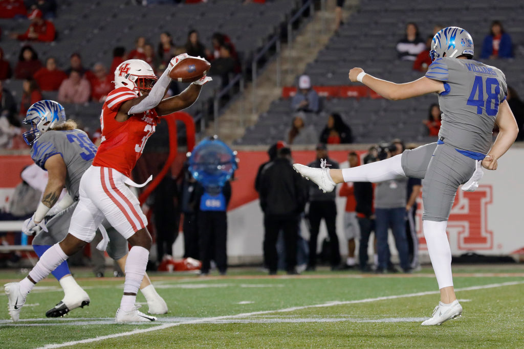 HOUSTON, TX - NOVEMBER 16:  Gervarrius Owens #32 of the Houston Cougars blocks a punt by Adam Williams #48 of the Memphis Tigers in the fourth quarter at TDECU Stadium on November 16, 2019 in Houston, Texas.  (Photo by Tim Warner/Getty Images)