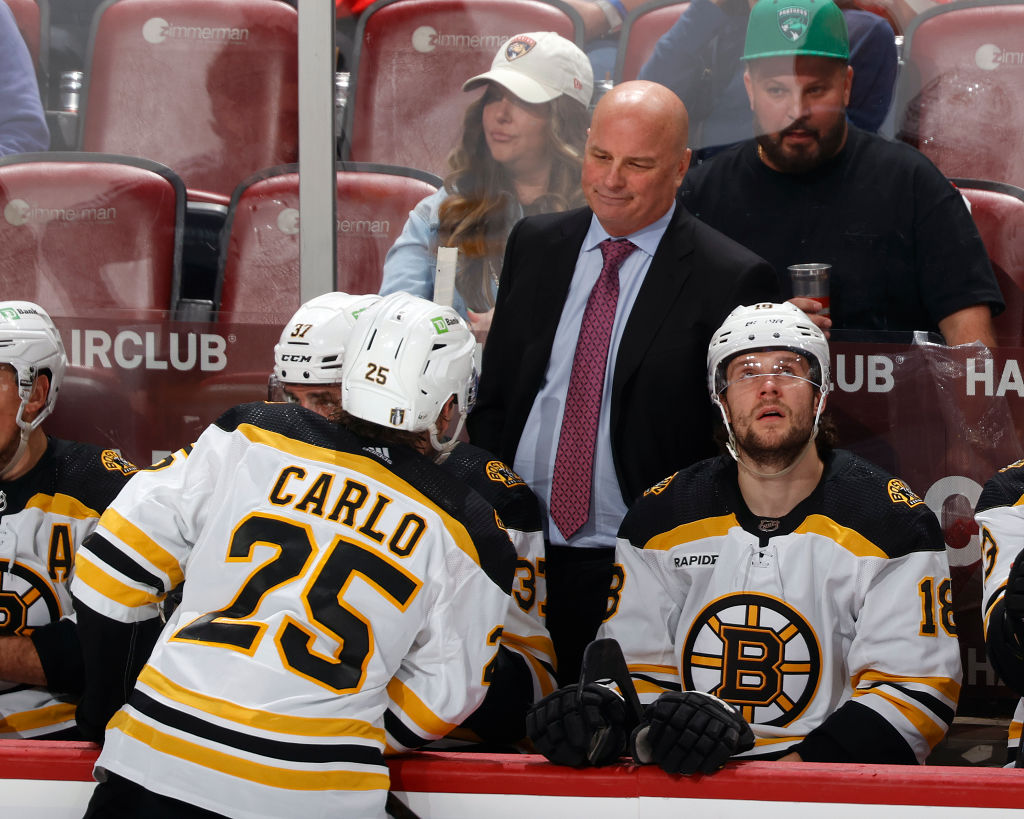SUNRISE, FL - APRIL 28: Head coach Jim Montgomery talks to Brandon Carlo #25 of the Boston Bruins during a break in action during the game against the Florida Panthers in Game Six of the First Round of the 2023 Stanley Cup Playoffs at the FLA Live Arena on April 28, 2023 in Sunrise, Florida. (Photo by Joel Auerbach/Getty Images)