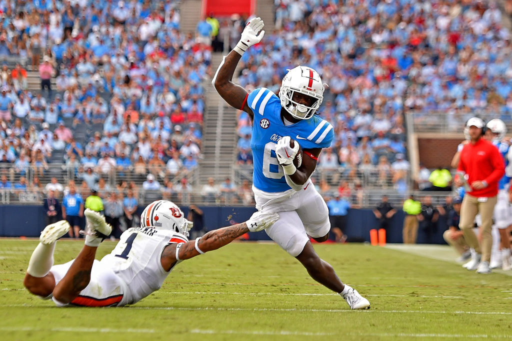 OXFORD, MISSISSIPPI - OCTOBER 15: Zach Evans #6 of the Mississippi Rebels carries the ball against Donovan Kaufman #1 of the Auburn Tigers during the second half at Vaught-Hemingway Stadium on October 15, 2022 in Oxford, Mississippi. (Photo by Justin Ford/Getty Images)