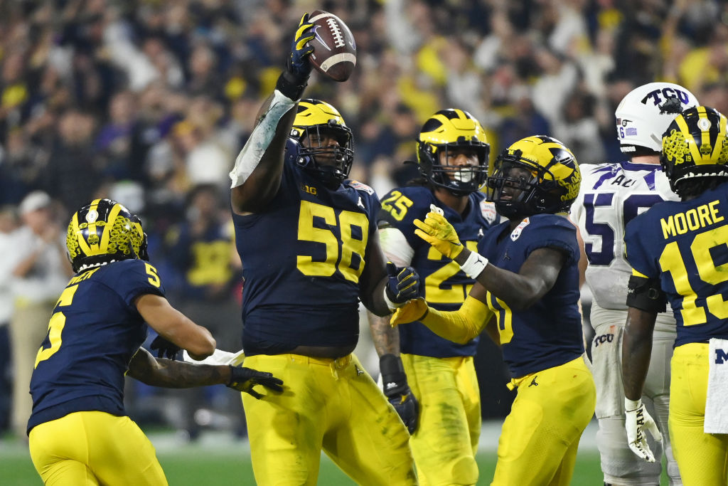 GLENDALE, ARIZONA - DECEMBER 31: Mazi Smith #58 of the Michigan Wolverines celebrates after recovering a fumble during the third quarter against the TCU Horned Frogs in the Vrbo Fiesta Bowl at State Farm Stadium on December 31, 2022 in Glendale, Arizona. (Photo by Norm Hall/Getty Images)