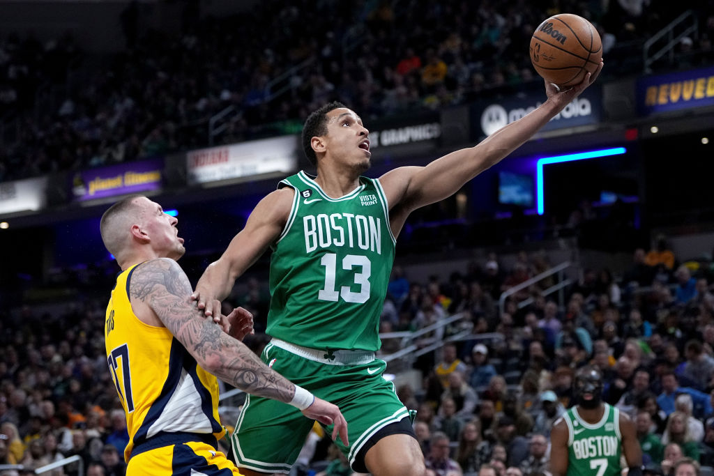 INDIANAPOLIS, INDIANA - FEBRUARY 23: Malcolm Brogdon #13 of the Boston Celtics attempts a layup while being guarded by Daniel Theis #27 of the Indiana Pacers in the second quarter at Gainbridge Fieldhouse on February 23, 2023 in Indianapolis, Indiana. (Photo by Dylan Buell/Getty Images)